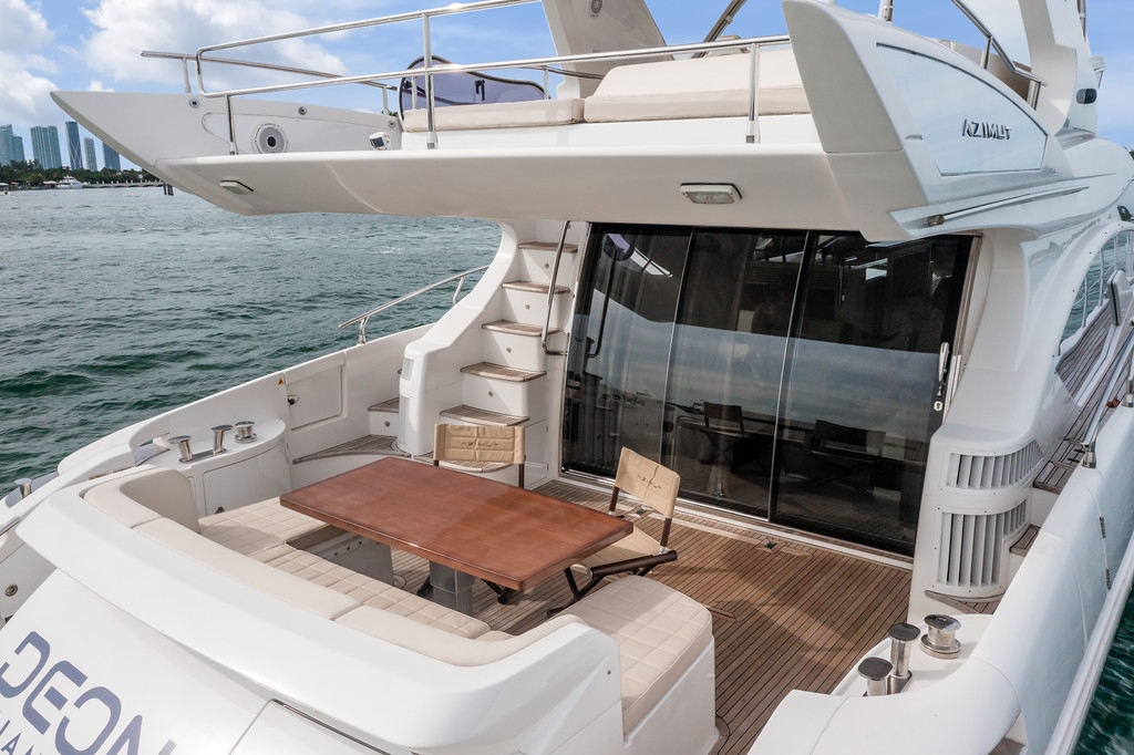 Aft deck dining setup aboard the Azimut Deon 64', dockside