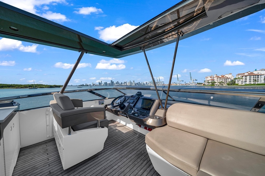 Marquis 66' flybridge with open bimini and the Miami skyline